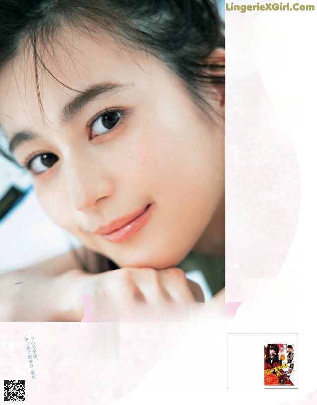 A magazine page with a picture of a woman's face.